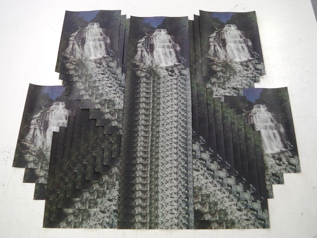Multiple laser prints and staggered superimposition to create a paper cascade