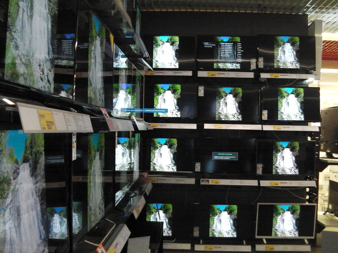 Multiple displays on TVs in an electrical goods store (detail view)