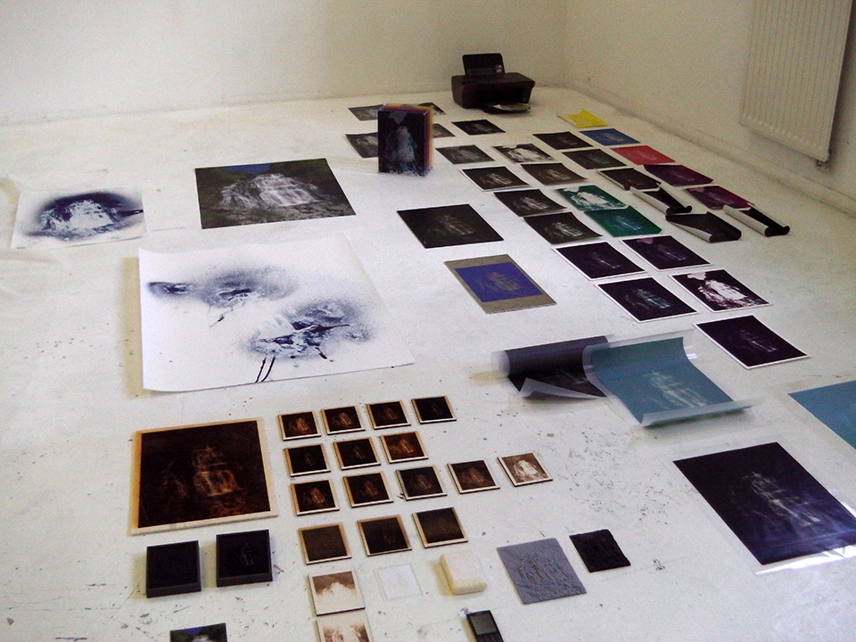 Photograph of all the pieces in the Cascades series laid out on the floor before hanging