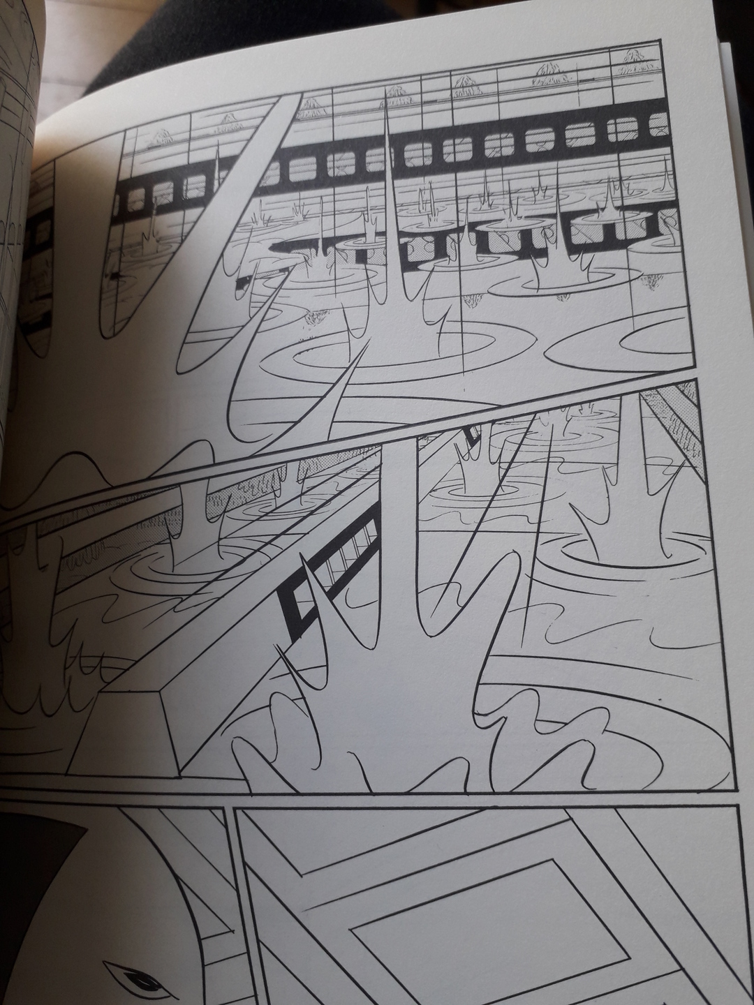 Image 1 : Page de bande-dessinée en noir et blanc représentant une averse (vue 1)